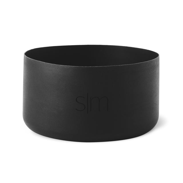 Matte black cylindrical boot product on white background with soft textured finish Matte black cylindrical boot product on white background with soft textured finish