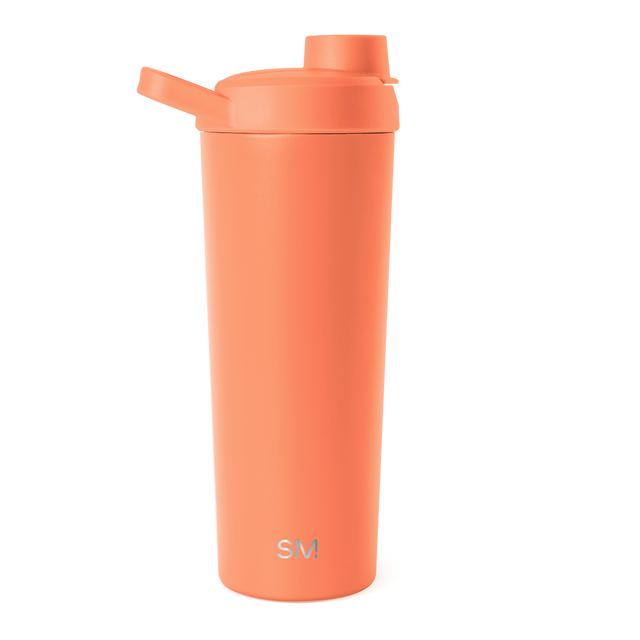 Vibrant coral-orange water bottle with matching lid against white background Vibrant coral-orange water bottle with matching lid against white background