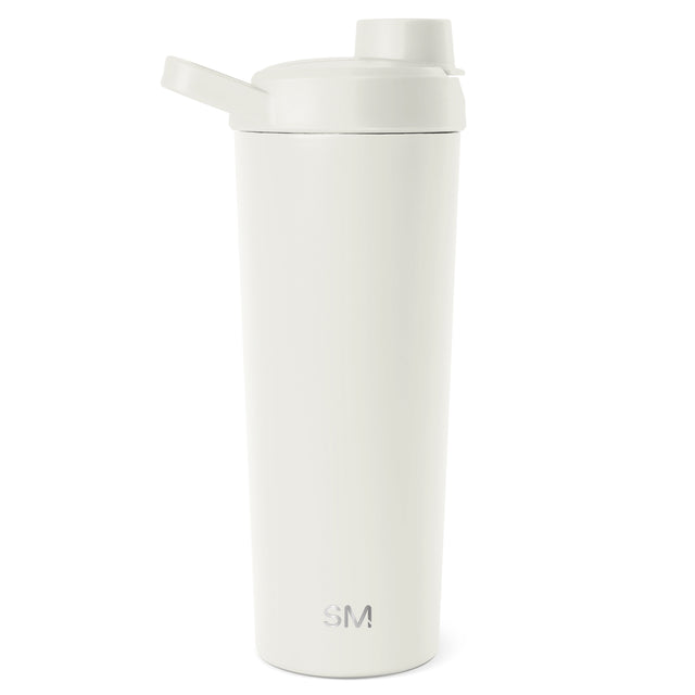 Cream-colored Simple Modern tumbler with integrated flip-top straw lid on white background. Cylindrical design with matte finish and embossed SM logo. Cream-colored Simple Modern tumbler with integrated flip-top straw lid on white background. Cylindrical design with matte finish and embossed SM logo.