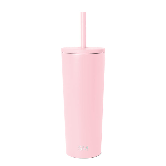 Pale pink Simple Modern tumbler with matching lid and straw, featuring embossed SM logo, cylindrical design with matte finish on white background. Pale pink Simple Modern tumbler with matching lid and straw, featuring embossed SM logo, cylindrical design with matte finish on white background.
