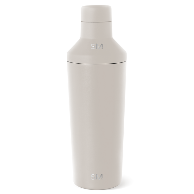 Cream-colored cosmetic bottle with minimalist design displayed against a white background Cream-colored cosmetic bottle with minimalist design displayed against a white background
