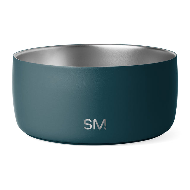 Teal cylindrical bowl with brushed stainless steel interior and SM logo, shown against white background in studio lighting. Teal cylindrical bowl with brushed stainless steel interior and SM logo, shown against white background in studio lighting.