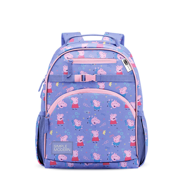 Periwinkle blue children's backpack with pink and coral accents, front mesh pockets, padded straps, chest strap with pink buckle, and playful print featuring cartoon pigs and stars. Simple Modern brand label visible. Periwinkle blue children's backpack with pink and coral accents, front mesh pockets, padded straps, chest strap with pink buckle, and playful print featuring cartoon pigs and stars. Simple Modern brand label visible.