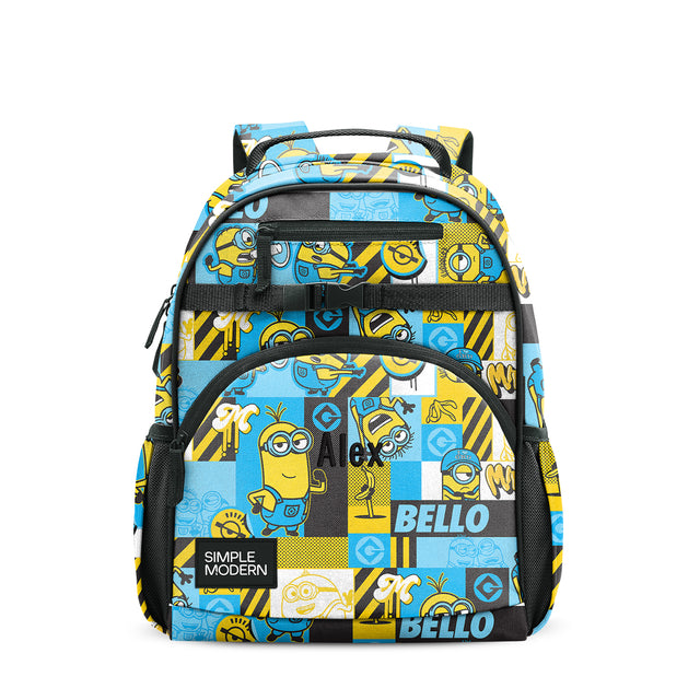 Minion-themed children's backpack with yellow, blue, white, and black patchwork design, black mesh pockets, padded straps, and top handle, shown front view on white background. Minion-themed children's backpack with yellow, blue, white, and black patchwork design, black mesh pockets, padded straps, and top handle, shown front view on white background.
