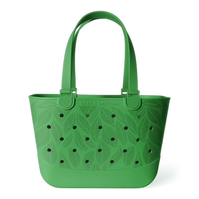 Green bucket tote bag with tropical leaf pattern and perforated details, featuring sturdy handles and Green bucket tote bag with tropical leaf pattern and perforated details, featuring sturdy handles and