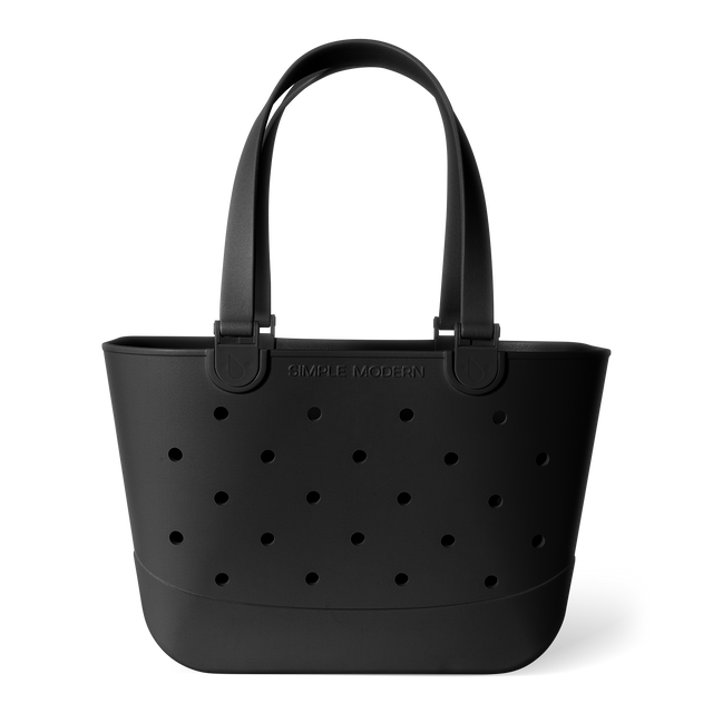 Matte black tote bag with perforated grid pattern and curved handles on white background. Features Matte black tote bag with perforated grid pattern and curved handles on white background. Features