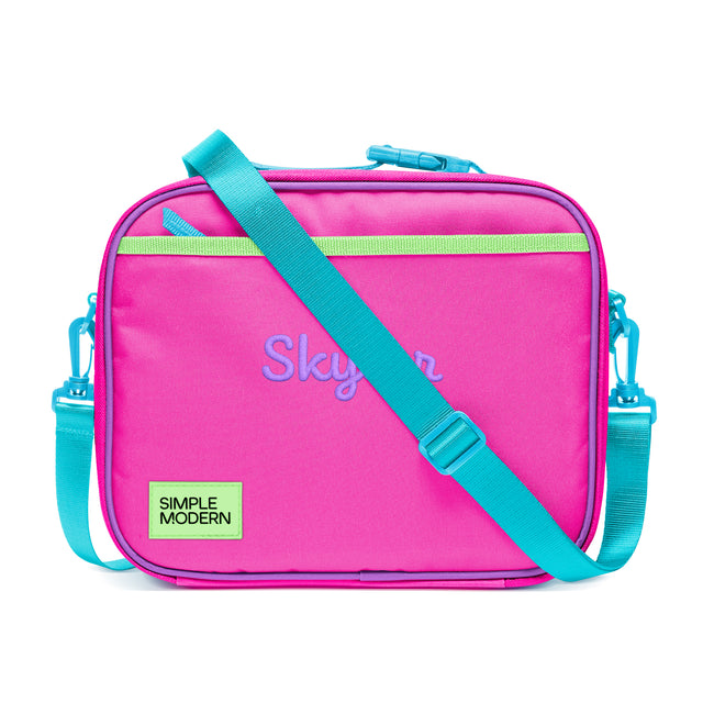 Hot pink insulated lunch bag with turquoise zipper, handles, and straps. Features lime green stripe detail, purple Hot pink insulated lunch bag with turquoise zipper, handles, and straps. Features lime green stripe detail, purple