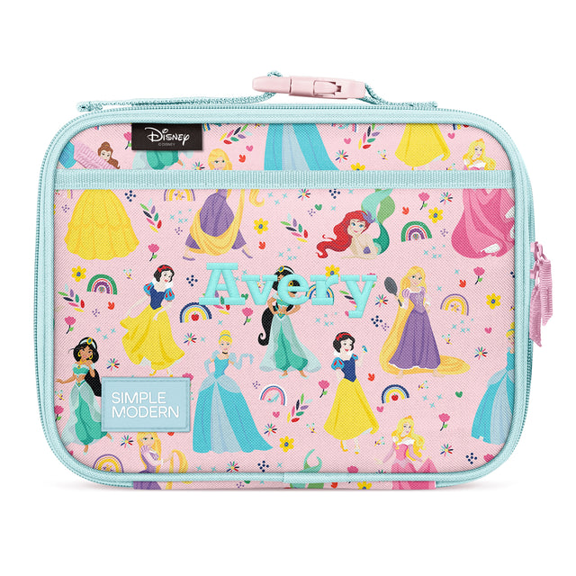 Pink insulated lunch box featuring Disney Princess characters in ball gowns with rainbow, flower, and star designs. Turquoise handles and zipper, shoulder strap attachment. Simple Modern brand. Pink insulated lunch box featuring Disney Princess characters in ball gowns with rainbow, flower, and star designs. Turquoise handles and zipper, shoulder strap attachment. Simple Modern brand.