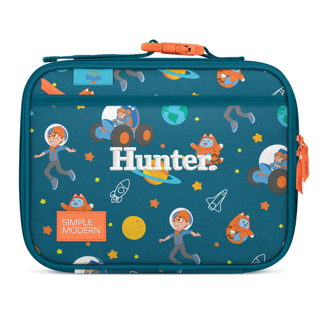 Teal insulated lunch box with space-themed design featuring cartoon astronauts, rockets, and planets. Orange carry handle and zipper pulls. Blippi brand character Teal insulated lunch box with space-themed design featuring cartoon astronauts, rockets, and planets. Orange carry handle and zipper pulls. Blippi brand character