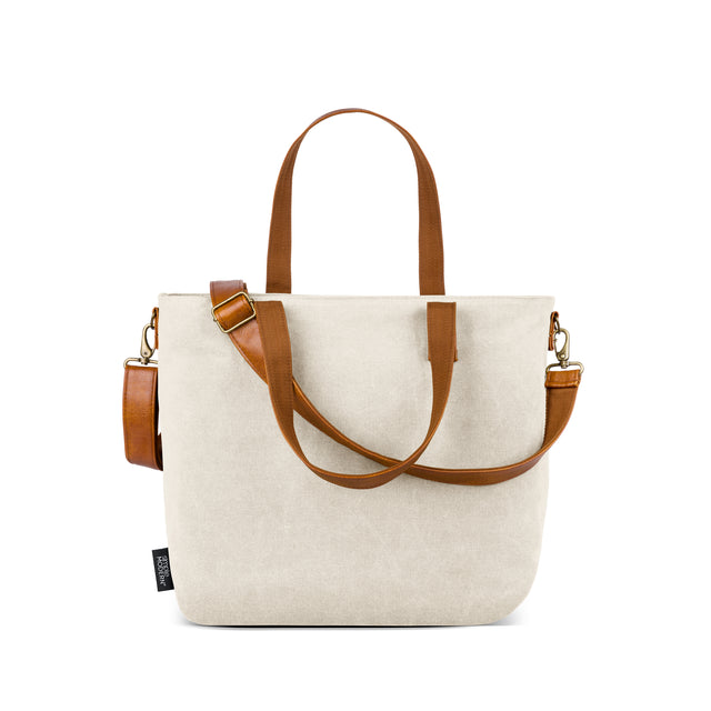 Light beige linen tote bag with cognac and tan brown leather accents Light beige linen tote bag with cognac and tan brown leather accents