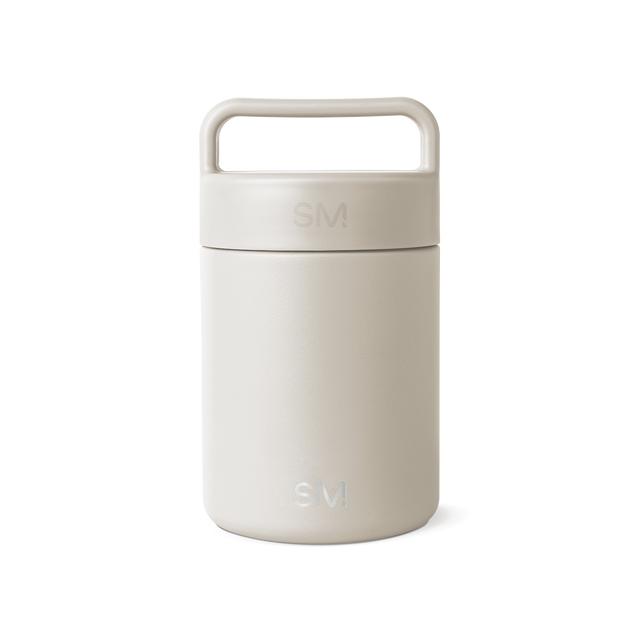 Cream-colored jar with lid on white background Cream-colored jar with lid on white background