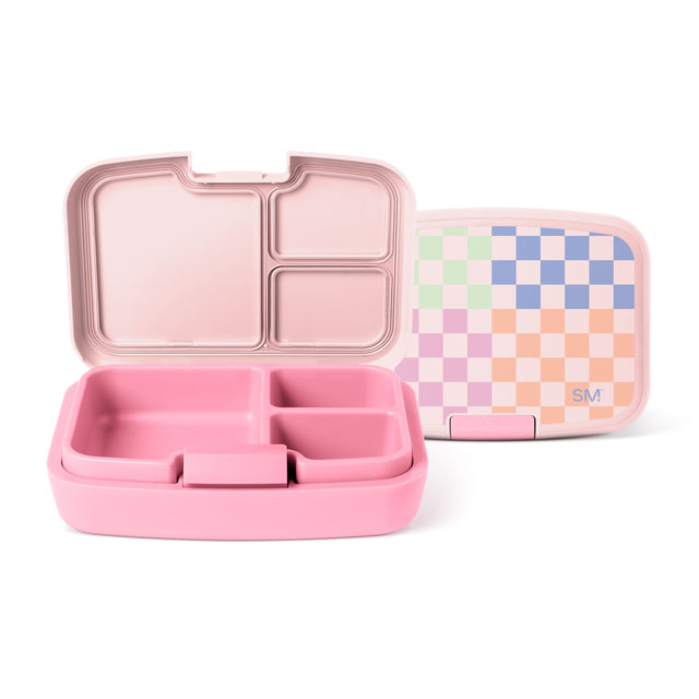 Pink bento lunch box by Simple Modern with divided compartments shown open next to matching lid featuring pastel checkerboard pattern in mint green, cream, periwinkle blue, lavender, and peach tones. Pink bento lunch box by Simple Modern with divided compartments shown open next to matching lid featuring pastel checkerboard pattern in mint green, cream, periwinkle blue, lavender, and peach tones.