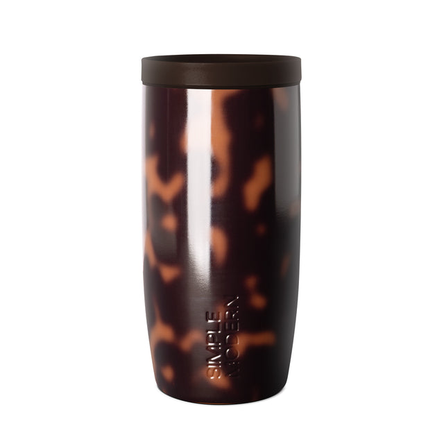 16-ounce tortoiseshell tumbler with dark brown and black mottled pattern, bright white vertical accent stripe, and matte black lid on white background 16-ounce tortoiseshell tumbler with dark brown and black mottled pattern, bright white vertical accent stripe, and matte black lid on white background