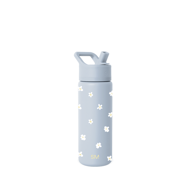 Blue-gray glass bottle with scattered white and pale yellow flower motifs on the surface. Blue-gray glass bottle with scattered white and pale yellow flower motifs on the surface.
