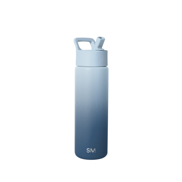 Simple Modern insulated water bottle with ombre gradient from light blue-gray to navy blue, featuring angular carry handle, flip spout, and SM logo emblem. Simple Modern insulated water bottle with ombre gradient from light blue-gray to navy blue, featuring angular carry handle, flip spout, and SM logo emblem.
