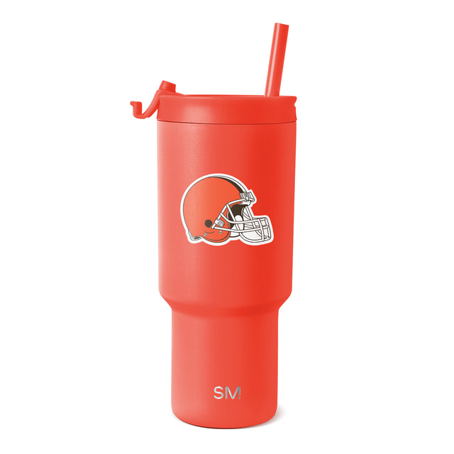 Coral red tumbler with matching straw on white background Coral red tumbler with matching straw on white background
