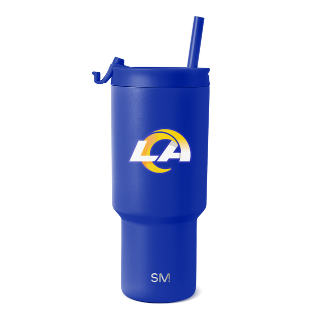 Royal blue tumbler with white and gold logo accents on clean white background Royal blue tumbler with white and gold logo accents on clean white background