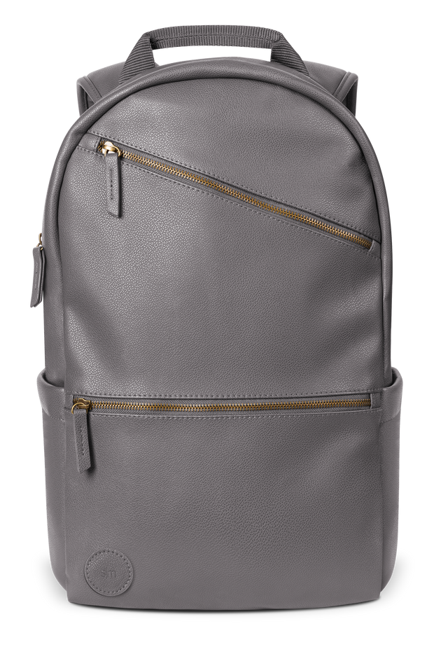 Gray canvas backpack with gold-toned metal hardware and zippers Gray canvas backpack with gold-toned metal hardware and zippers