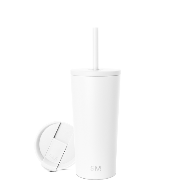 White insulated tumbler with matching white lid and reusable straw, featuring subtle gray shadows on clean white background