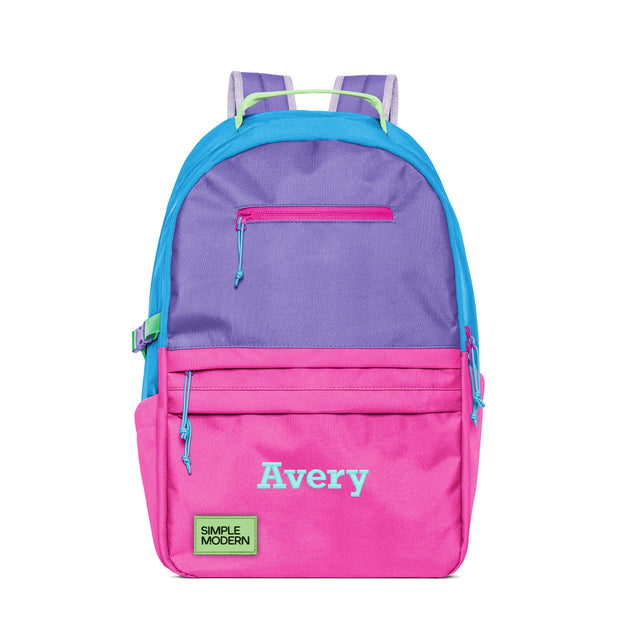 Colorful children's backpack with fuchsia pink, purple, and turquoise color blocks, personalized with 