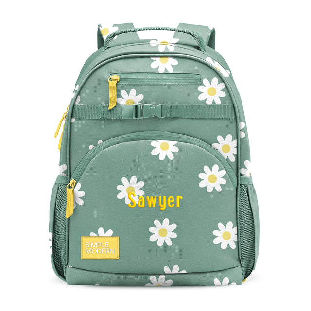 Sage green children's backpack with white daisy pattern, yellow-gold zipper accents, padded straps, side water bottle pockets, and 