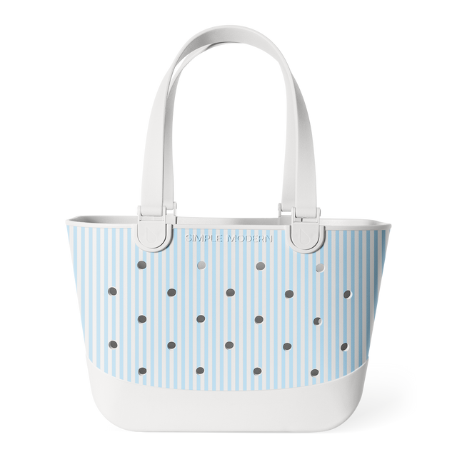 Light blue and white striped tote bag with white handles, metal grommets across the front, and 