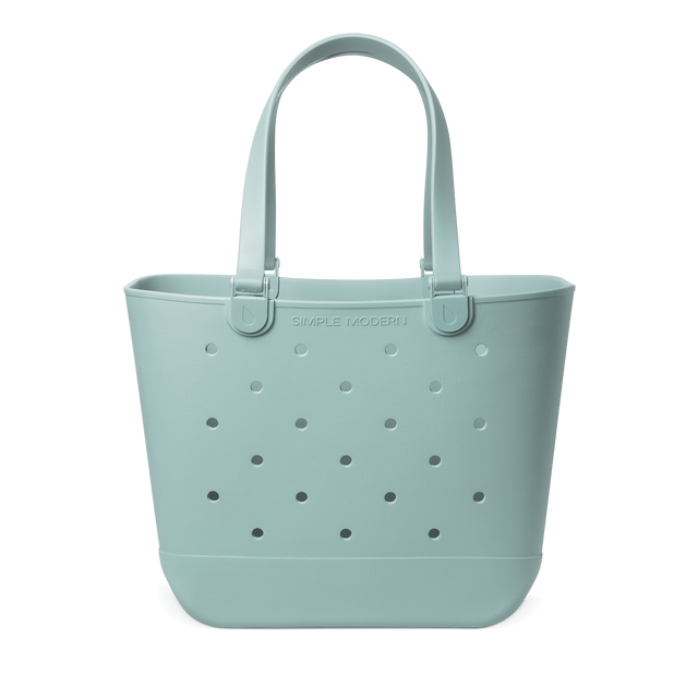 Sage green canvas tote bag with handles, shown against a white background.