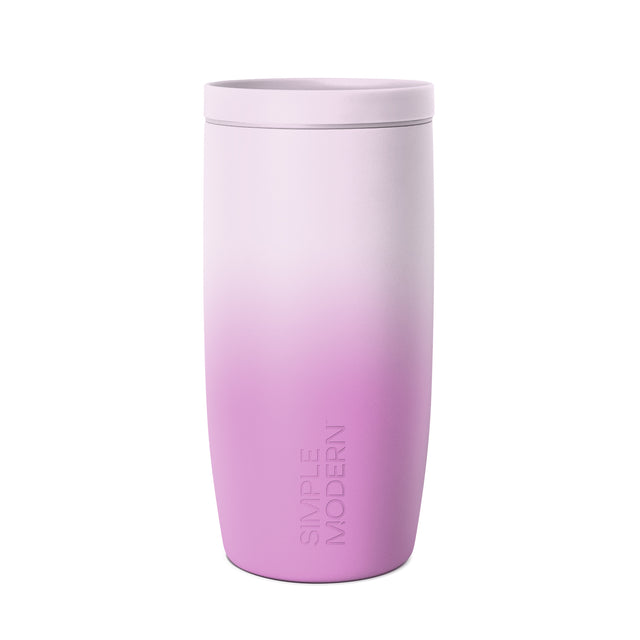 Lavender to magenta ombre tumbler with lid against white background. Simple Modern branding visible on lower body. Matte finish cylindrical drinkware with rounded base and fitted lid.