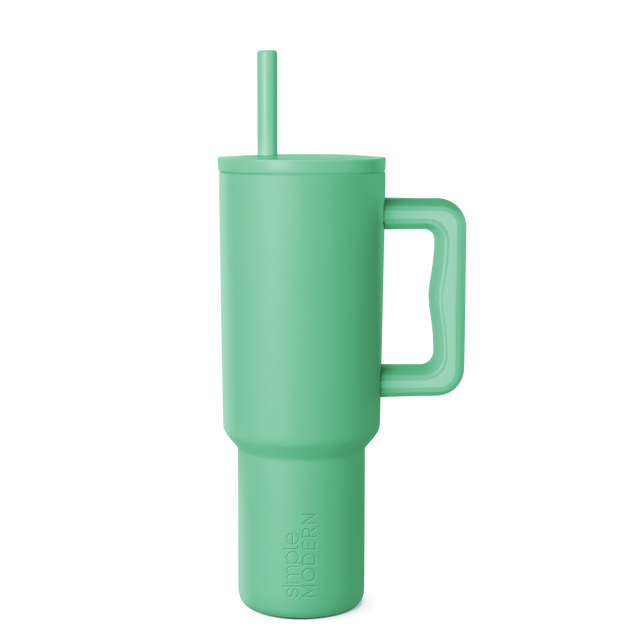 Soft sage green tumbler with clean background, modern muted celadon color throughout, calming aesthetic design