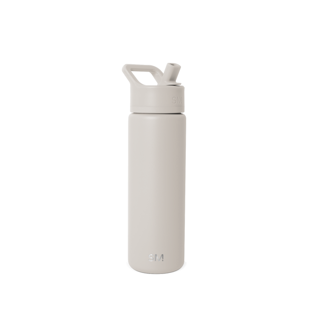 Beige and cream colored water bottle against light off-white background