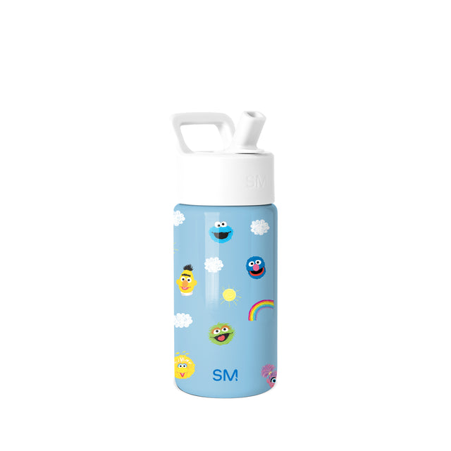 Sky blue Simple Modern water bottle with white lid and handle, decorated with Sesame Street characters including Cookie Monster, Elmo, Big Bird, Bert, and Oscar, plus clouds, sun, and rainbow on light blue background.