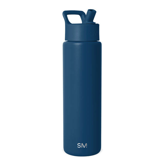 Navy blue Simple Modern insulated water bottle with flip-top spout and carry handle, displayed against white background. SM logo visible on front.