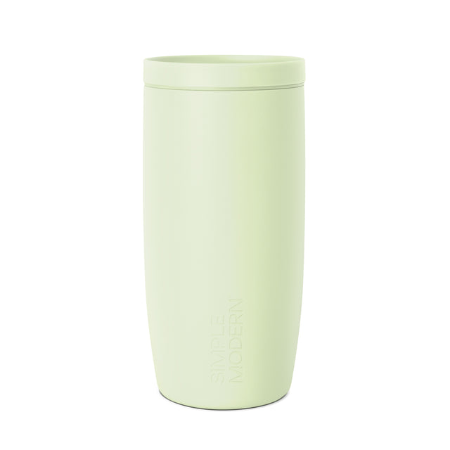 Pale sage green insulated tumbler with matching lid, minimalist design, Simple Modern branding, centered on white background.