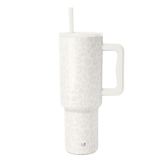 White stainless steel tumbler with textured dotted pattern, matching white lid, large handle, and white straw, featuring Simple Modern logo on neutral background.