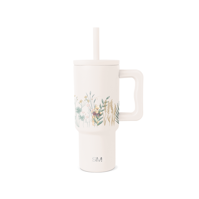 Cream-colored tumbler with muted watercolor botanical illustration on front