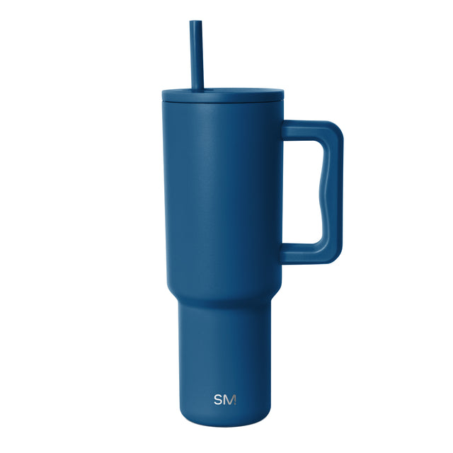 Deep teal insulated tumbler with handle and matching lid featuring integrated straw. Simple Modern logo displayed on body. Studio product shot on white background.